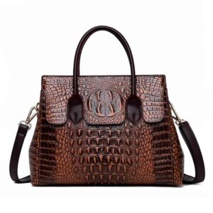 sac bandoulière en cuir Brun style rétro effet crocodile sur fond Vit