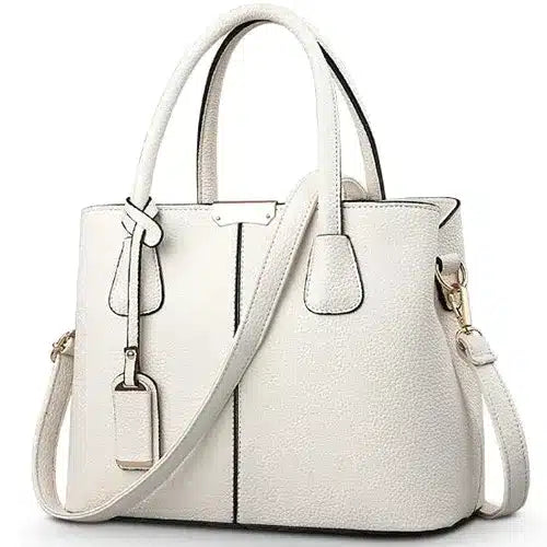 sac à main bandoulière beige en cuir sur fond Vit