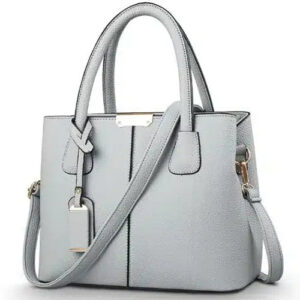 sac à main bandoulière gris en cuir sur fond Vit