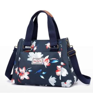 sac bandoulière Marinblå avec des fleurs sur fond Vit.