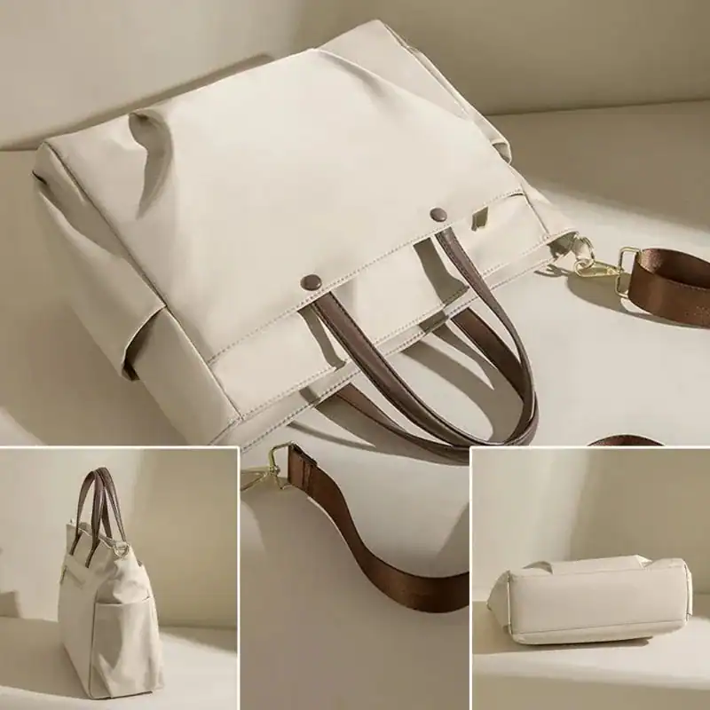 Beige datorväska med bruna handtag och axelrem, elegant arbetsväska för kvinnor.