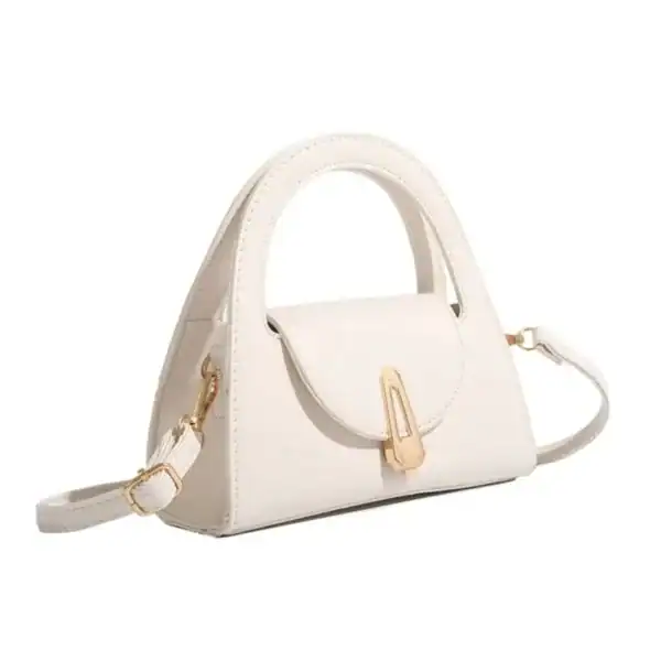Beige liten handväska med handtag och axelrem, elegant damhandväska.