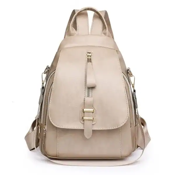 Beige ryggsäck dam med guldaktiga detaljer och praktiskt design.