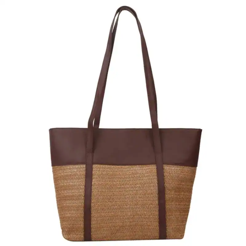 Brun beige flätad shoppingväska med läderdetaljer och långt handtag.