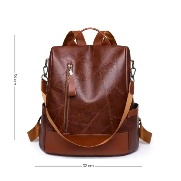 Brun ryggsäck med fack, läderliknande material, 34 cm hög, 32 cm bred.