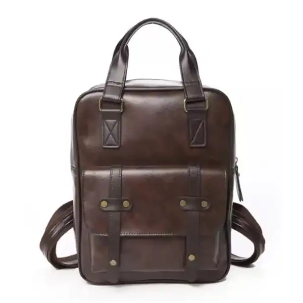 Brun skolväska med ryggsäck och handtag, vintage design.