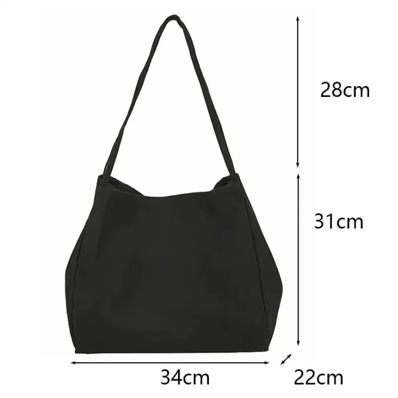 Brun tygshopper med mått 34x22x31 cm, ideal för vardaglig användning.