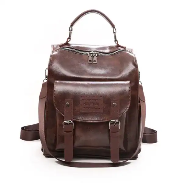 Brun vintage ryggsäck dam, läder, retro design, axelväska, skolväska, handtag.