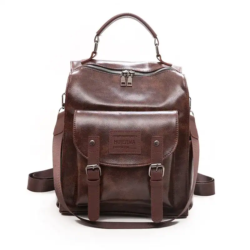 Brun vintage ryggsäck dam, läder, retro design, axelväska, skolväska, handtag.