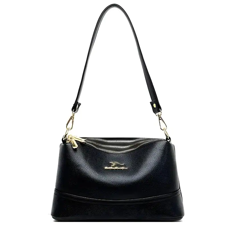 Svart Axelväska Cognac liten crossbody med guld dragkedja och axelrem.