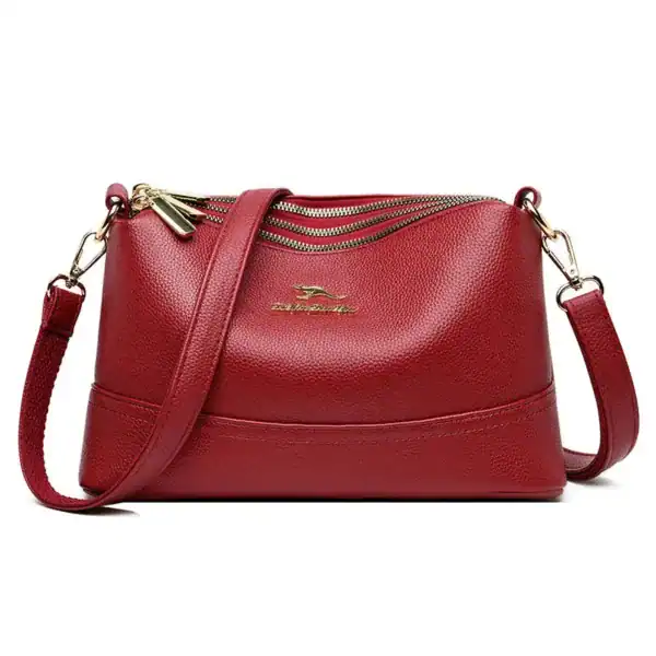 Rött läder crossbody väska med dragkedja och axelrem, Cognac liten modell.