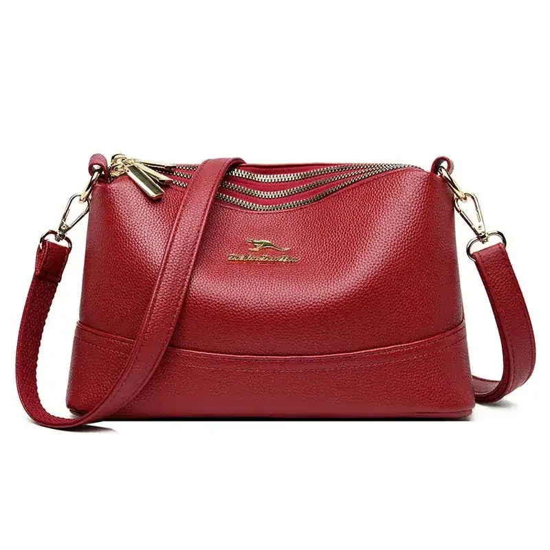 Rött läder crossbody väska med dragkedja och axelrem, Cognac liten modell.