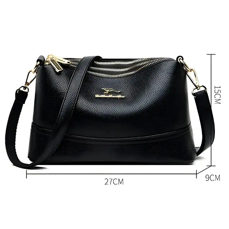 Cognac liten crossbody axelväska svart, läder, guld dragkedja, axelrem, storlek 27x15x9 cm.