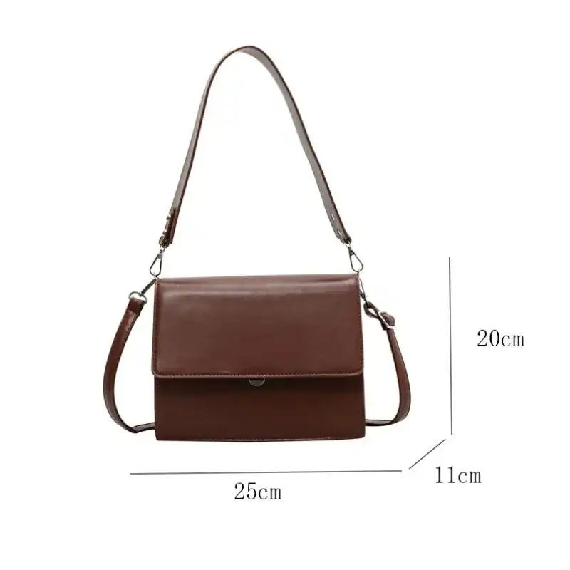 Cognac färgad axelväska med lock, läder, 25x20x11 cm.