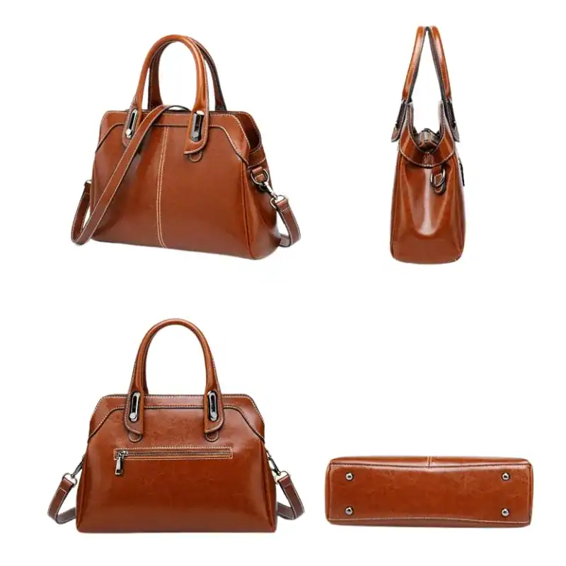 Cognacfärgad handväska med axelrem, läder, damväska, elegant, arbetsplats.