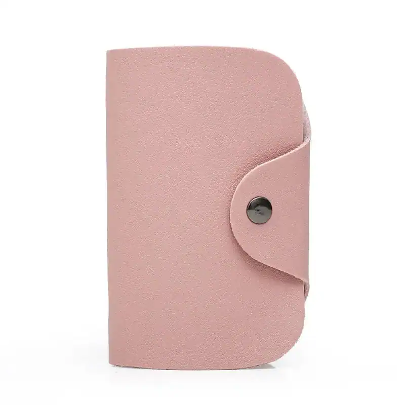 Grå väskset tre delar, rosa axelväska med knapp och rundad kant.