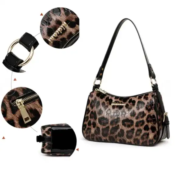 Leopard hobo väska med svart krokodiltextur och guldaktiga dragkedjor.