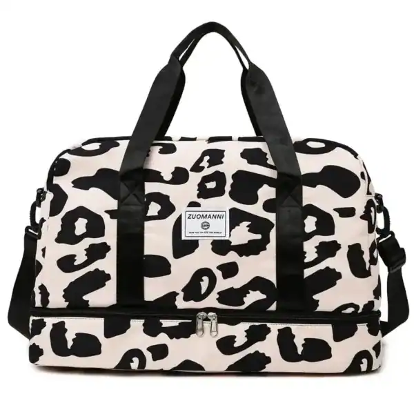 Leopard mönster weekendbag med svarta handtag och axelrem.