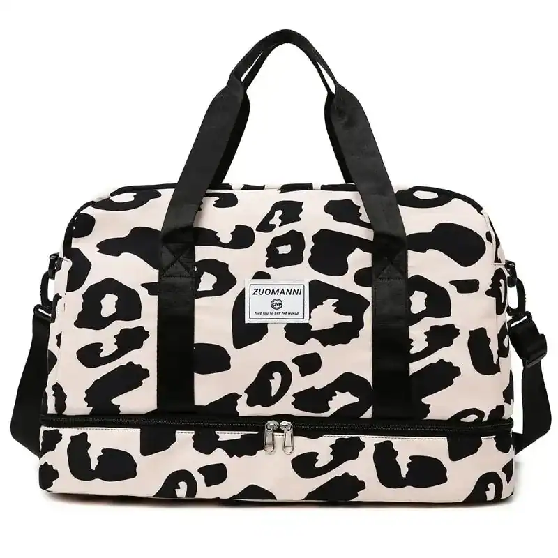 Leopard mönster weekendbag med svarta handtag och axelrem.