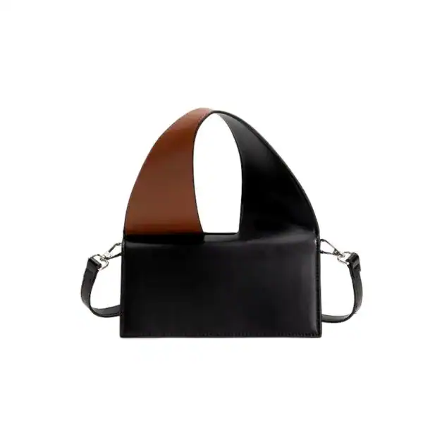 Liten svart väska med brunt handtag och axelrem, modern design.