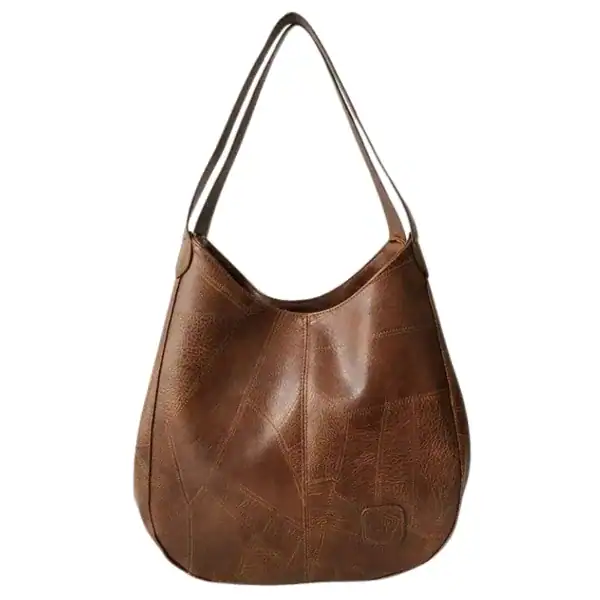 Metallic hobo väska i brunt läder med patchwork mönster och enkel handtag.