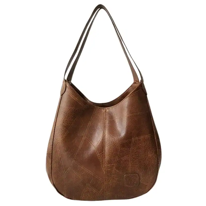 Metallic hobo väska i brunt läder med patchwork mönster och enkel handtag.