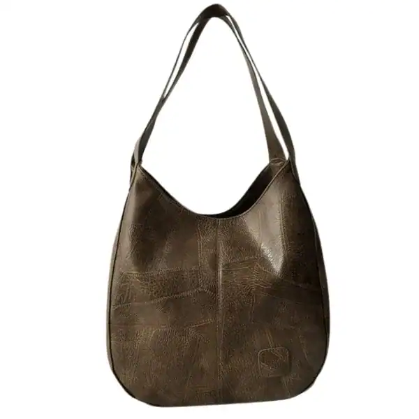 Metallic hobo väska i brunt, med texturerad yta och axelrem.