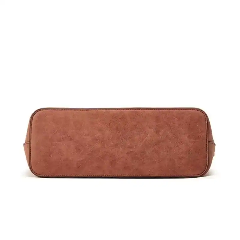 Mintgrön väskset, axelväska i brunt läder med texturerad yta och exklusiv design.
