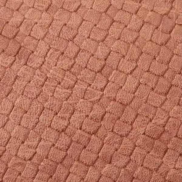 Mintgrön väskset med mjuk, texturerad yta och färgstarkt rosa ton.