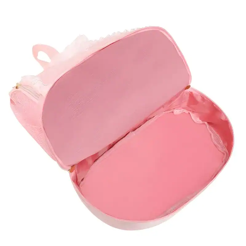 Rosa dansryggsäck med öppen inre, ideal för barn och ungdomar.