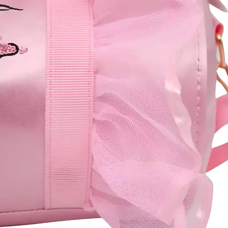 Rosa dansväska för barn med tull och broderi.