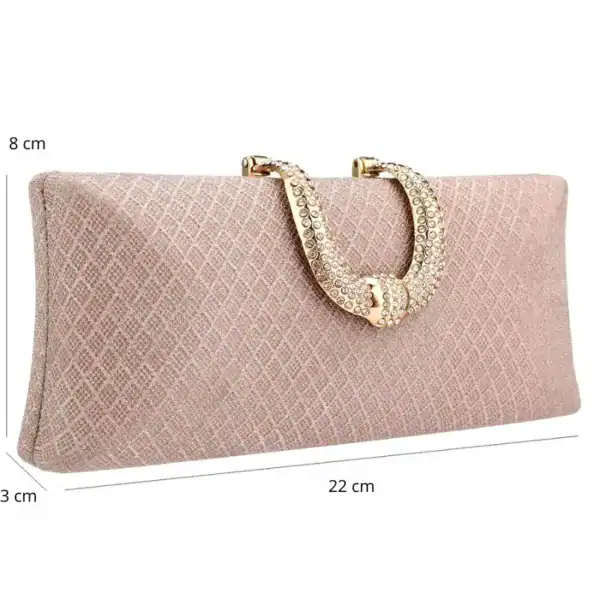 Rosa rutmönstrad clutch med glittrande handtag och mått 22x8x3 cm.