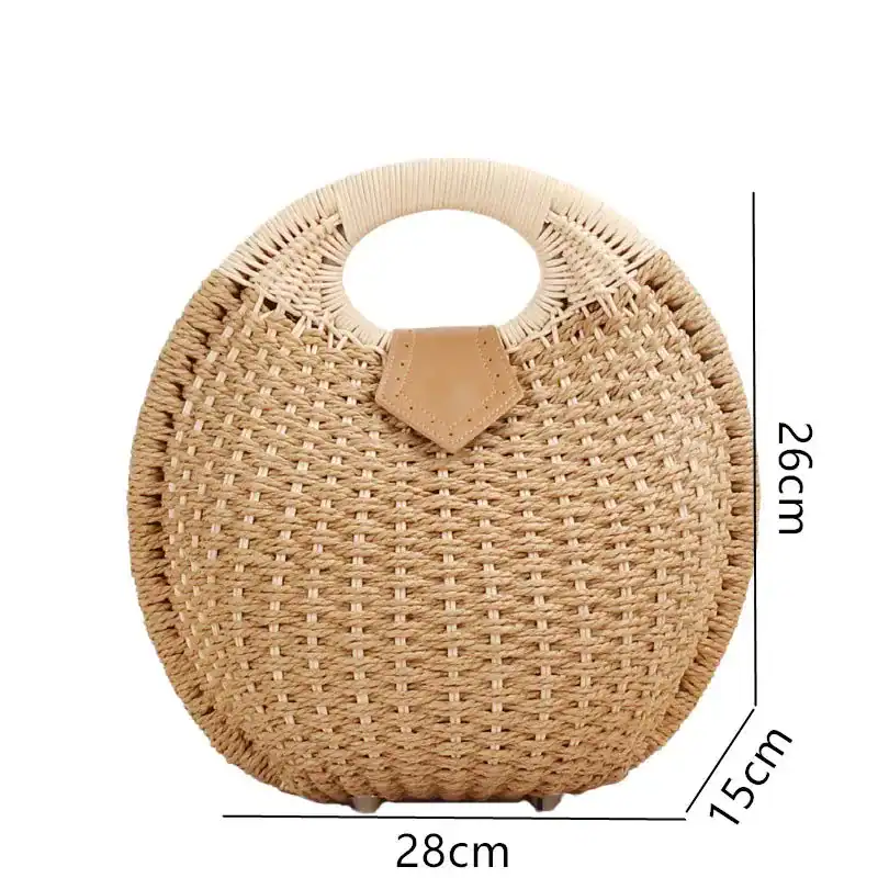 Rund rotingväska i naturfärgad rödrot, med handtag och mått 28x26x15 cm.