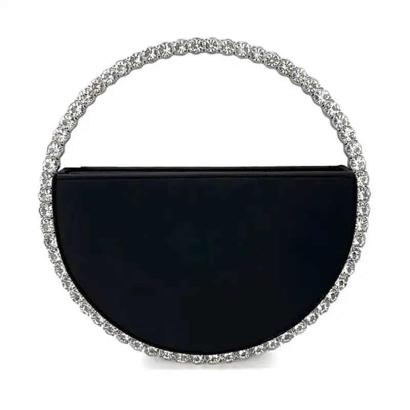 Svart rund clutch med strass och silverfärgad kant.