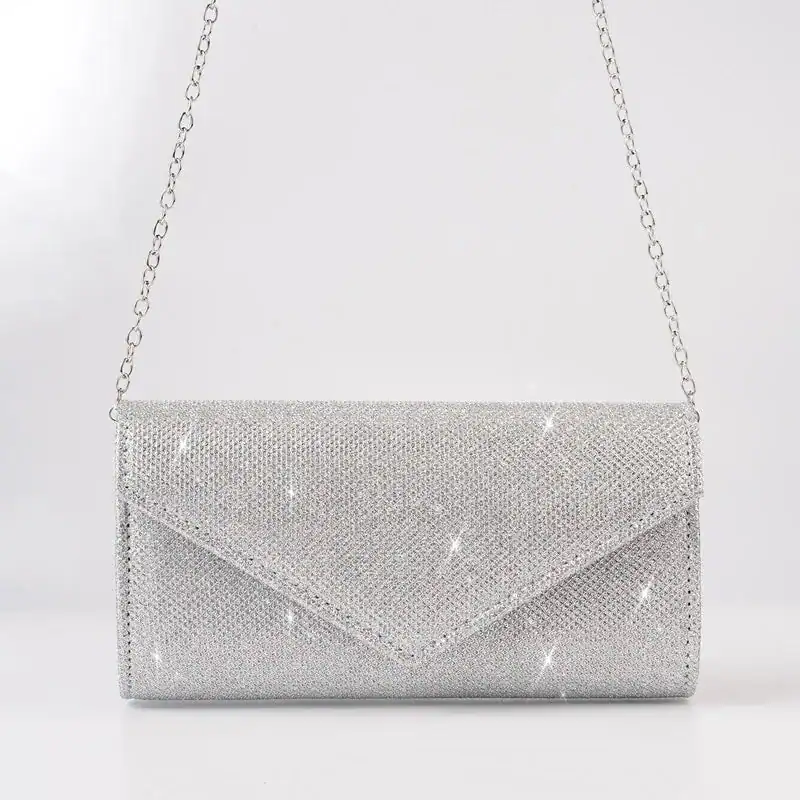 Silver glitter clutch med kedja, elegant axelväska för fest och kväll.