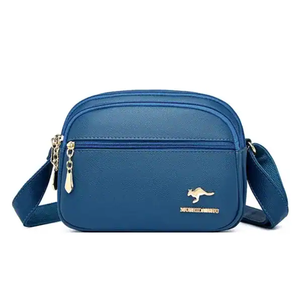 Svart liten crossbody väska med guld detaljer och metalldetalj.