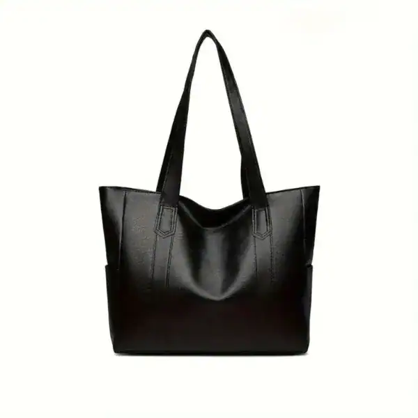 Svart tote bag med långt handtag och elegant design för vardag och stil.