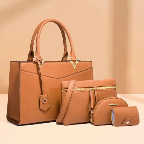 Svart väskset fyra delar, elegant handväskor och tillbehör i samma design.