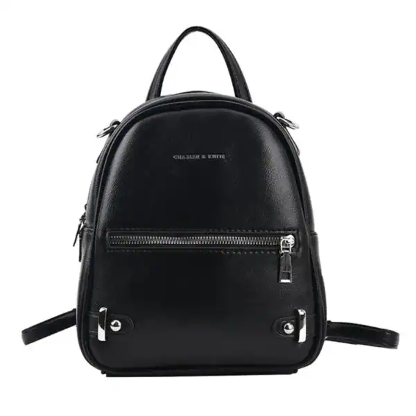 Vinröd liten ryggsäck från Charles & Keith, perfekt för daglig användning och skola.