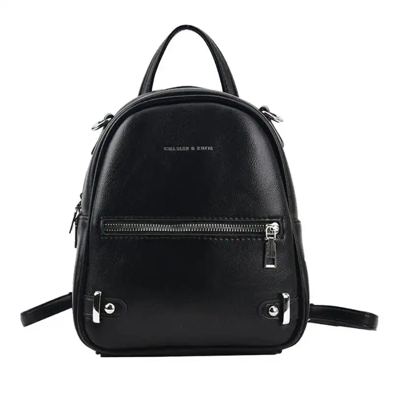 Vinröd liten ryggsäck från Charles & Keith, perfekt för daglig användning och skola.