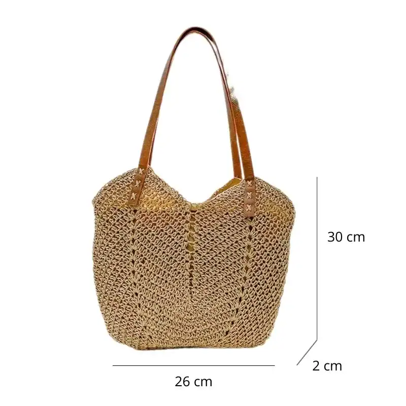 Virkad shoppingväska i naturfärgad rör, med läderhandtag och mått 30x26x2 cm.