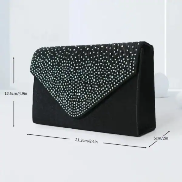 Svart glitterclutch med pärlor, elegant klädsel för fest, kvällsklänning, bröllop.