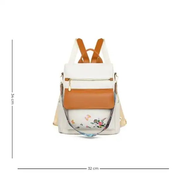 Vit ryggsäck med blommönster och orange detaljer, 34 cm hög.